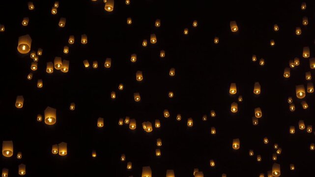 Thai people release sky floating lanterns or lamp to worship Buddha's relics at night. Traditional festival in Chiang mai, Thailand. Loy krathong