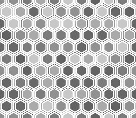 Honeycomb mosaic background. Rounded hexagons mosaic pattern with inner solid cells. Grey color tones. Hexagonal shapes. Tileable pattern. Seamless vector illustration.