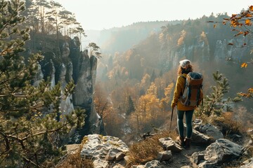 Obraz premium Active woman traveler walking along hiking trails in the mountains among forests and cliffs. Trekking, active lifestyle concept, Generative AI