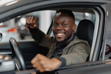 Obraz premium Joyful african american man holding steering wheel shaking fist while sitting in car at car dealership, Generative AI