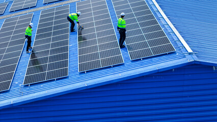 engineer man inspects construction of solar cell panel or photovoltaic cell by electronic device....