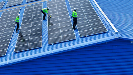 engineer man inspects construction of solar cell panel or photovoltaic cell by electronic device....