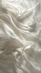 Obraz premium White satin fabric flowing creating abstract shapes background