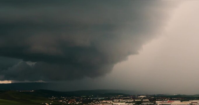 Extreme weather, supercell storm clouds over Cluj city, dramatic huge tornado