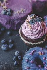 Colorful cakes on a dark background, beautiful picture