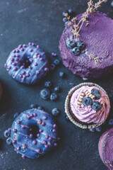 Colorful cakes on a dark background, beautiful picture