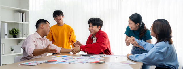 Excited and happy startup company employee celebrate after make successful strategic business...