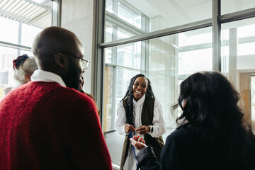 Successful black woman engaging with colleagues in a corporate meeting - Powered by Adobe