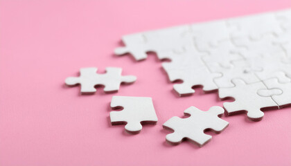 White puzzle pieces on pink background. Brain game.