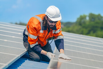 Worker Technicians are working to construct solar panels system on roof. Installing solar photovoltaic panel system. Men technicians walking on roof structure to check photovoltaic solar modules.