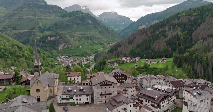 Aerial view Rocca Pietore italy cityscape. Beautiful buildings at the foot of the Dolomite Alps travel and tourism. High quality 4k footage