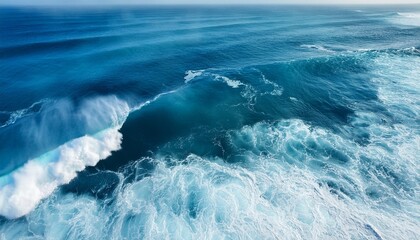 beautiful photo of blue water flowing in waves with white foam in a ocean taken from up top above perspective wallpaper background 16 9