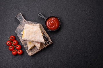 Delicious juicy roll or shawarma with chicken, tomatoes, salad and sauce
