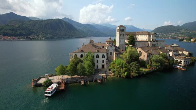 Most beautiful italian villages - unique romantic island San Giulio in Orta lake ( Lago di Orta) in Piedmont Province of Novara . aerial drone 4k hd video