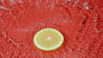 Close up of fresh orange slices water splashing on separated background. Macrography of sliced...