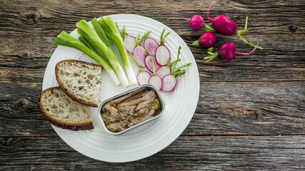 Deliciously Crafted Platter Featuring Fresh Vegetables and Sardine on rustic Wooden Table