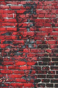 Fototapeta Weathered red bricks form a textured wall with irregular patterns.