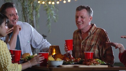 Family gather celebrate holiday with celebration meal. Family member together talk and have dinner...