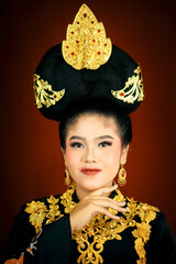 young asian women wearing makeup, wearing batik clothes and Indonesian cultural attributes