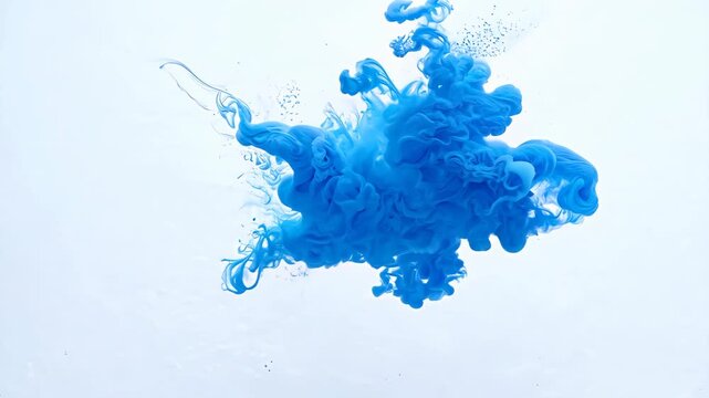 Blue ink cloud in water on white