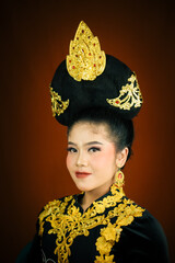 young asian women wearing makeup, wearing batik clothes and Indonesian cultural attributes