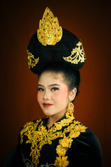 young asian women wearing makeup, wearing batik clothes and Indonesian cultural attributes