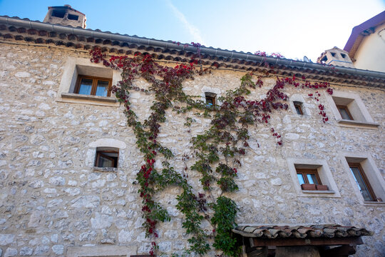 classic stone facade of townhouses  in little village in the Southern French Alps late summer