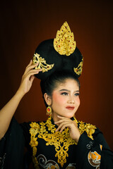 young asian women wearing makeup, wearing batik clothes and Indonesian cultural attributes