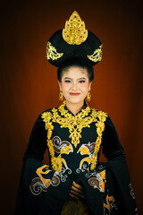 young asian women wearing makeup, wearing batik clothes and Indonesian cultural attributes