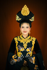 young asian women wearing makeup, wearing batik clothes and Indonesian cultural attributes