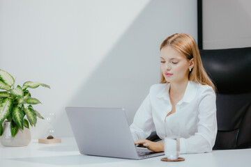 Young Professional Woman Working on Laptop