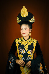 young asian women wearing makeup, wearing batik clothes and Indonesian cultural attributes