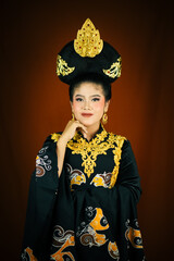 young asian women wearing makeup, wearing batik clothes and Indonesian cultural attributes