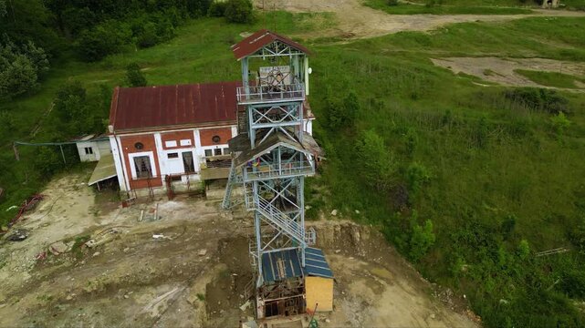 Stunning Aerial Drone Footage of the Top of an Elevator Shaft in the Vast Salina Slanic Prahova Salt Mine, Carpathian Mountains, Romania - A Unique Perspective of an Underground Wonder
