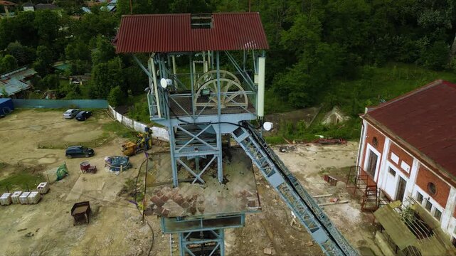Stunning Aerial Drone Footage of the Top of an Elevator Shaft in the Vast Salina Slanic Prahova Salt Mine, Carpathian Mountains, Romania - A Unique Perspective of an Underground Wonder
