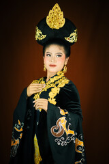 young asian women wearing makeup, wearing batik clothes and Indonesian cultural attributes