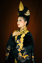 young asian women wearing makeup, wearing batik clothes and Indonesian cultural attributes