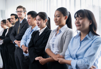 Modern diversity and multicultural company, business people joining hand together and standing in line, shared commitment to collaboration and cooperation concept background. Meticulous