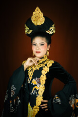 young asian women wearing makeup, wearing batik clothes and Indonesian cultural attributes