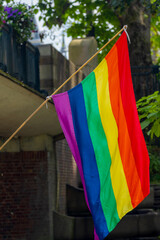 Celebration of pride month in Amsterdam, Peoples holding a colourful rainbow flag for street walk, Symbol of Gay, Lesbian, Baisexaul and Transgender, LGBTQIA community, Social movement in Netherlands.
