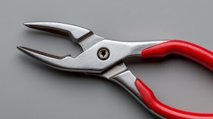 Bent nose pliers with red handles displayed on gray background