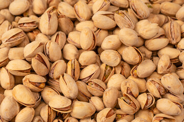 Fototapeta premium Tasty pistachios isolated on a white background.