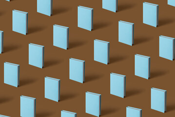 Pattern of  blue book on a brown background with soft shadow, copy space. Book Lovers Day concept