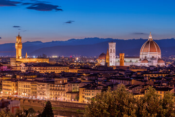 Obraz premium Florence, Italy. Panorama Sunset view at Duomo Santa Maria del Fiore cathedral and Palazzo Vecchio Tower. Panoramic View of Firenze during