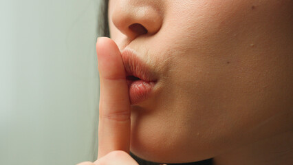 Close up female mouth Asian chinese korean japanese girl unrecognizable woman showing hush lips...