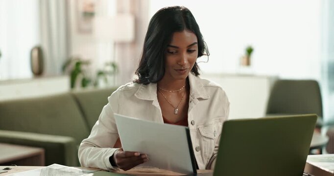 Laptop, Indian woman and home for online, note or paperwork for remote work from living room. Lounge, checklist or internet for language transcriber, technology or website for freelance female person