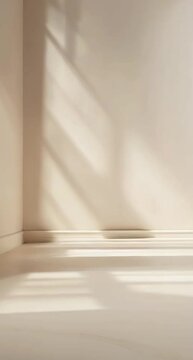 Close angle of a clean and empty background with soft light and botanical shaped shadows, in light, warm neutral tones.