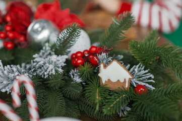 Merry Christmas and New Year. Gingerbread house with Christmas branches and decor