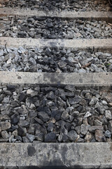 Vertical view of the middle of a track bed of a traditional railway track