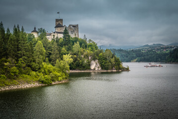 A beautiful castle in Niedzica with a cloudy sky.